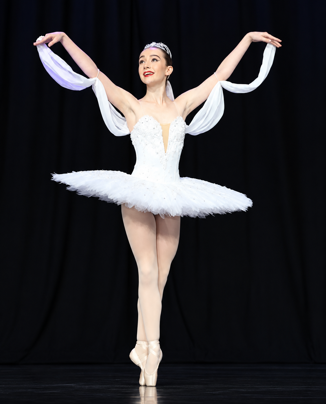Dancer wearing a hand-made white classical ballet tutu by The Beautiful Dancer